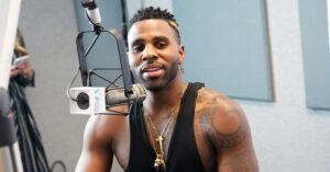 Jason Derulo goes vegan. Jason Derulo sits in front of a microphone at a radio station.