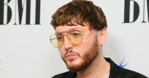 James Arthur in yellow tinted sunglasses