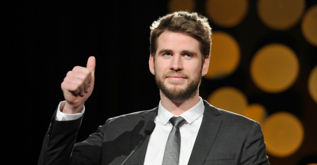 Liam Hemsworth puts a thumb up on stage at G'Day USA 2019