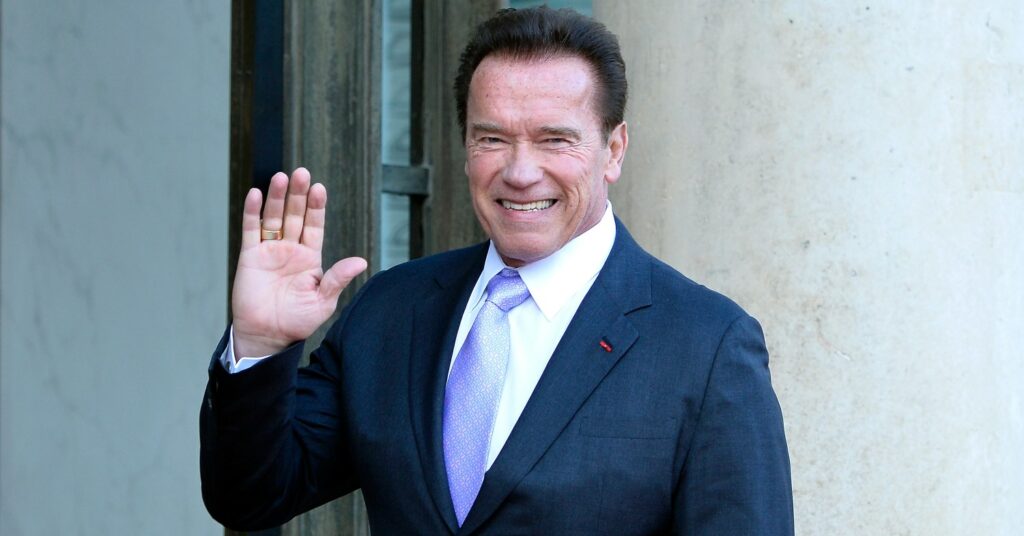 Arnold Schwarzenegger waving
