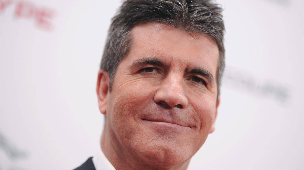 Simon Cowell Meets a Dog He Rescued From a Meat Farm