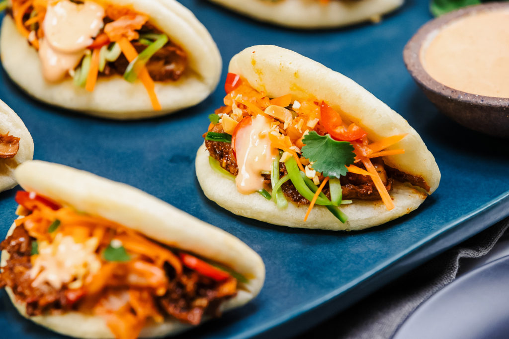 These vegan Bao buns are loaded with meatless pulled pork by plant-based brand Oumph!. | LIVEKINDLY