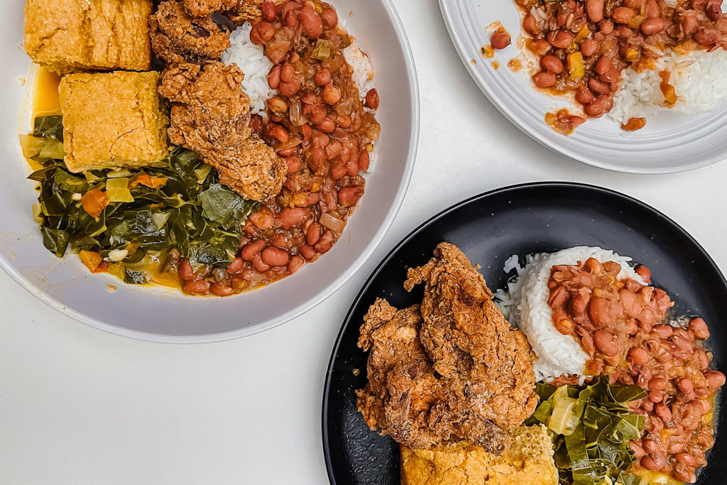 This vegan soul food meal features plant-based fried chicken, cornbread, 