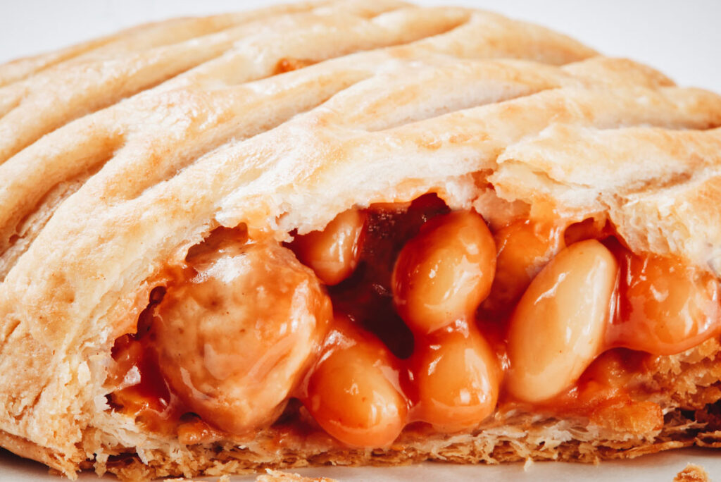 Close up photo of Greggs' new vegan Sausage, Bean, and Cheese Melt.