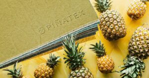 pinatex leather next to pineapples on a yellow background