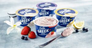 Silk's new range of vegan Greek yogurts next to fruits