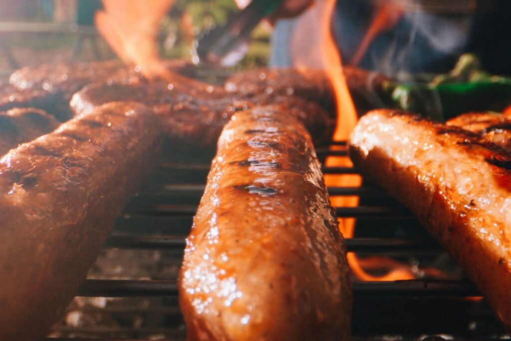 LikeMeat vegan sausages on a grill