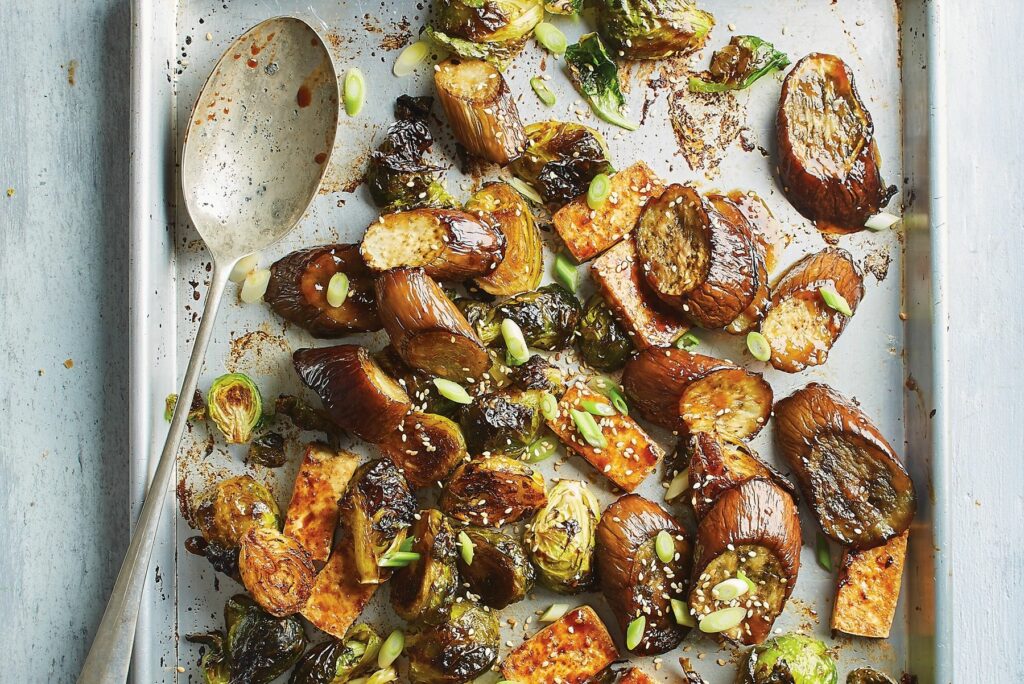 Photo of roasted eggplant and tofu on a sheet pan