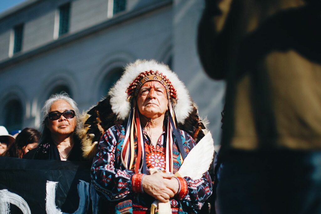 Chief Phil Lane of the Yankton Dakota and Chickasaw First Nations awaits his introduction to speak at a climate change rally. 