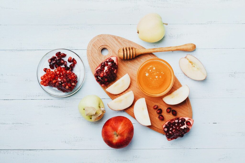 Traditional Rosh Hashanah foods: apples, pomegranates, and honey.