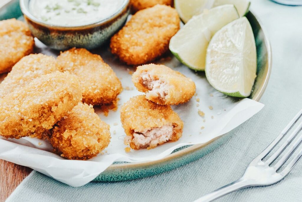 Photo shows a plate of lab-grown chicken nuggets.