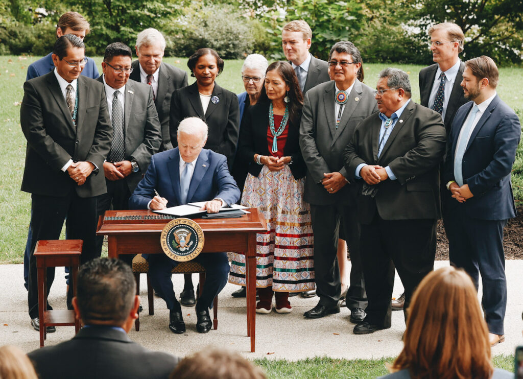 Photo shows U.S. President Joe Biden signing an executive order to expand the areas of three national monuments.
