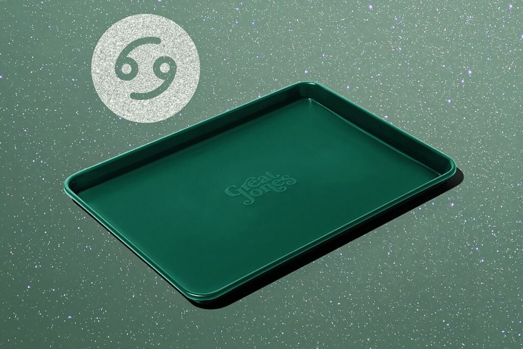 Photo shows a forest green baking sheet by the brand Great Jones