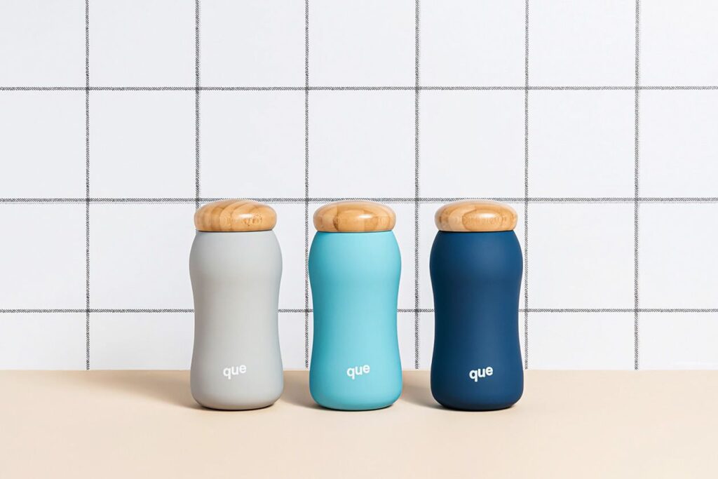 Photo shows three reusable water bottled with wooden lids