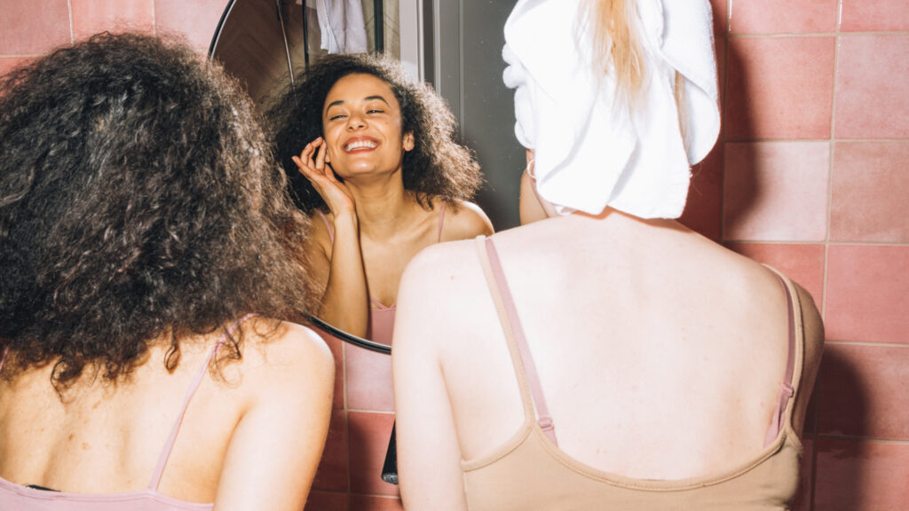 Photo shows two women doing their makeup in a mirror. Can zero-waste skincare save the beauty industry from its plastic problem?