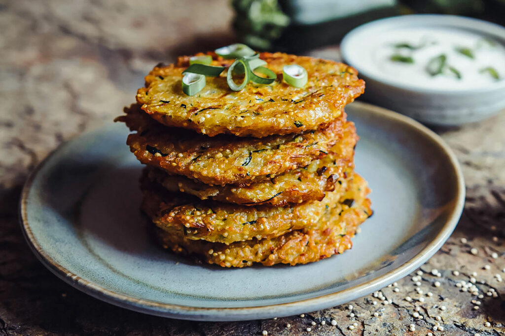 Photo shows a stack of amaranth fritters.