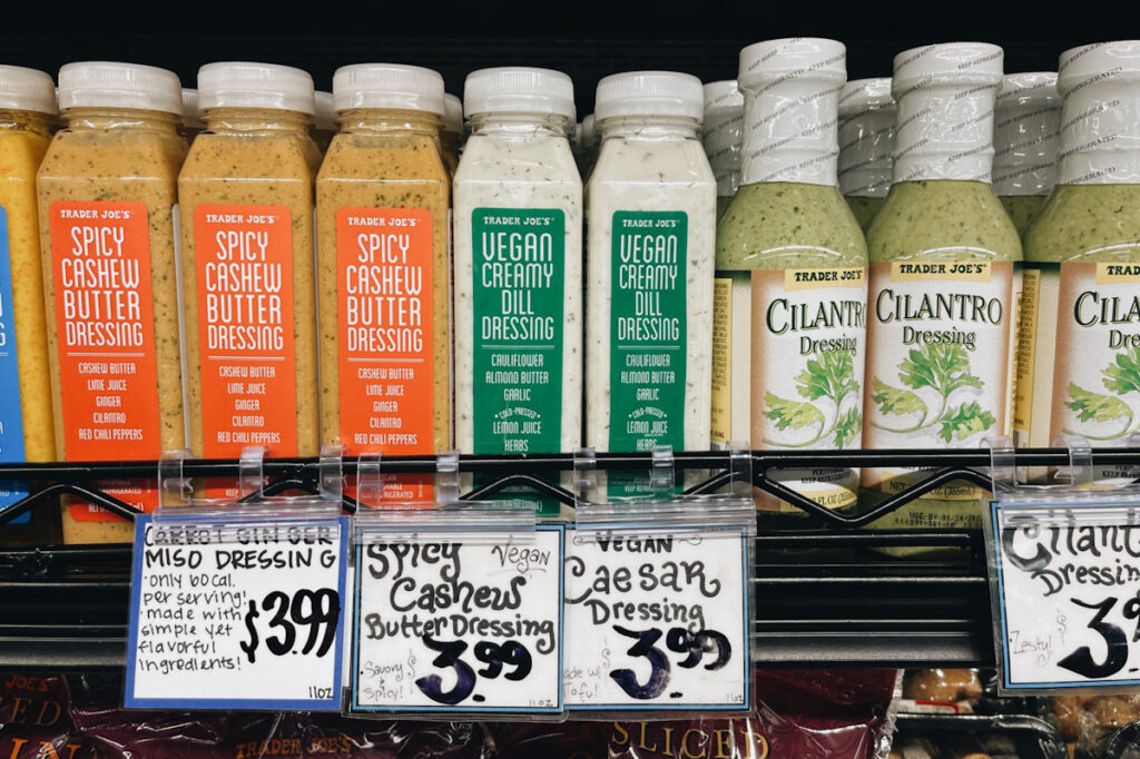 Photo shows three varieties of vegan-friendly Trader Joe's dressing.