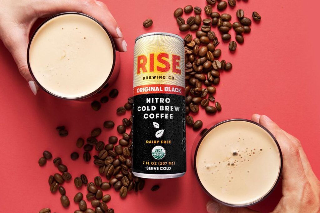 Photo shows RISE Nitro Cold Brew on a red background