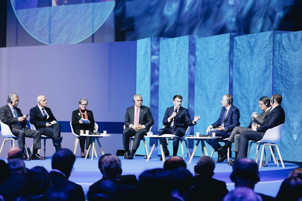 Photo shows French president Emmanuel Macron with Henry Puna (L), Olivier Poivre d'Arvor (2L), Najla Bouden (3L), Ivan Duque (4L), and Nicos Anastasiades (R) during the High Level Segment session of the One Ocean Summit.