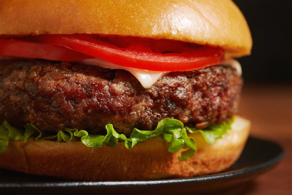 Photo shows a close-up of a plant-based burger
