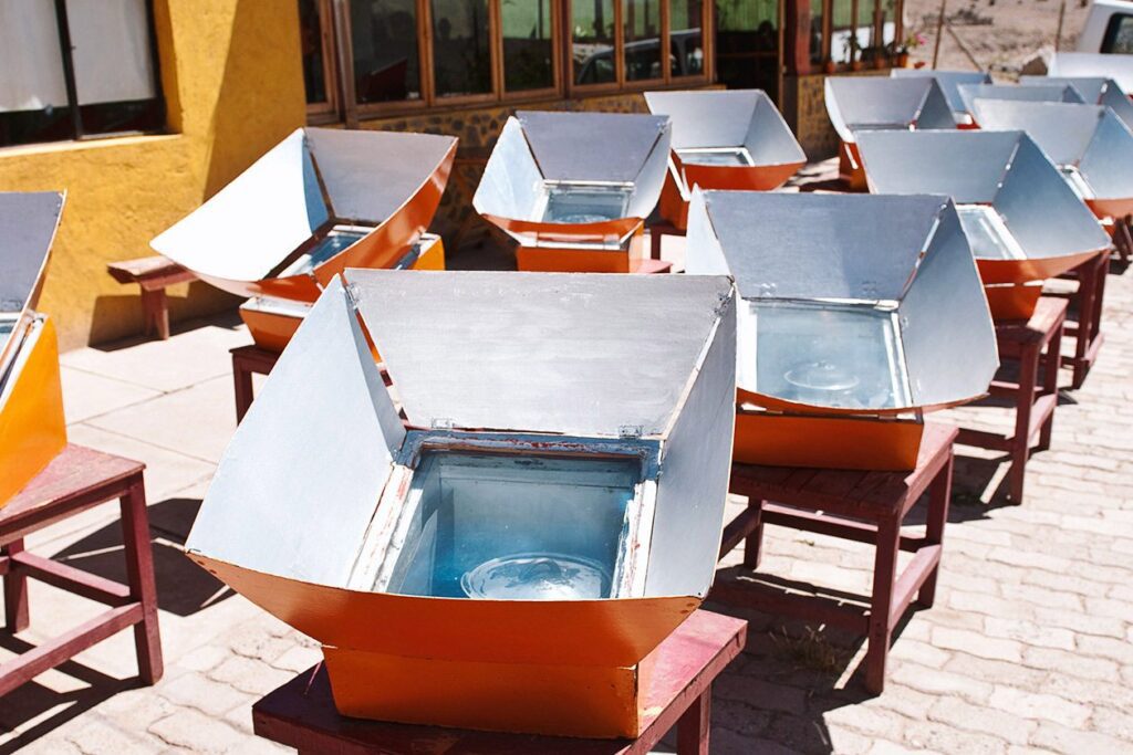 Photo shows solar-powered ovens on concrete